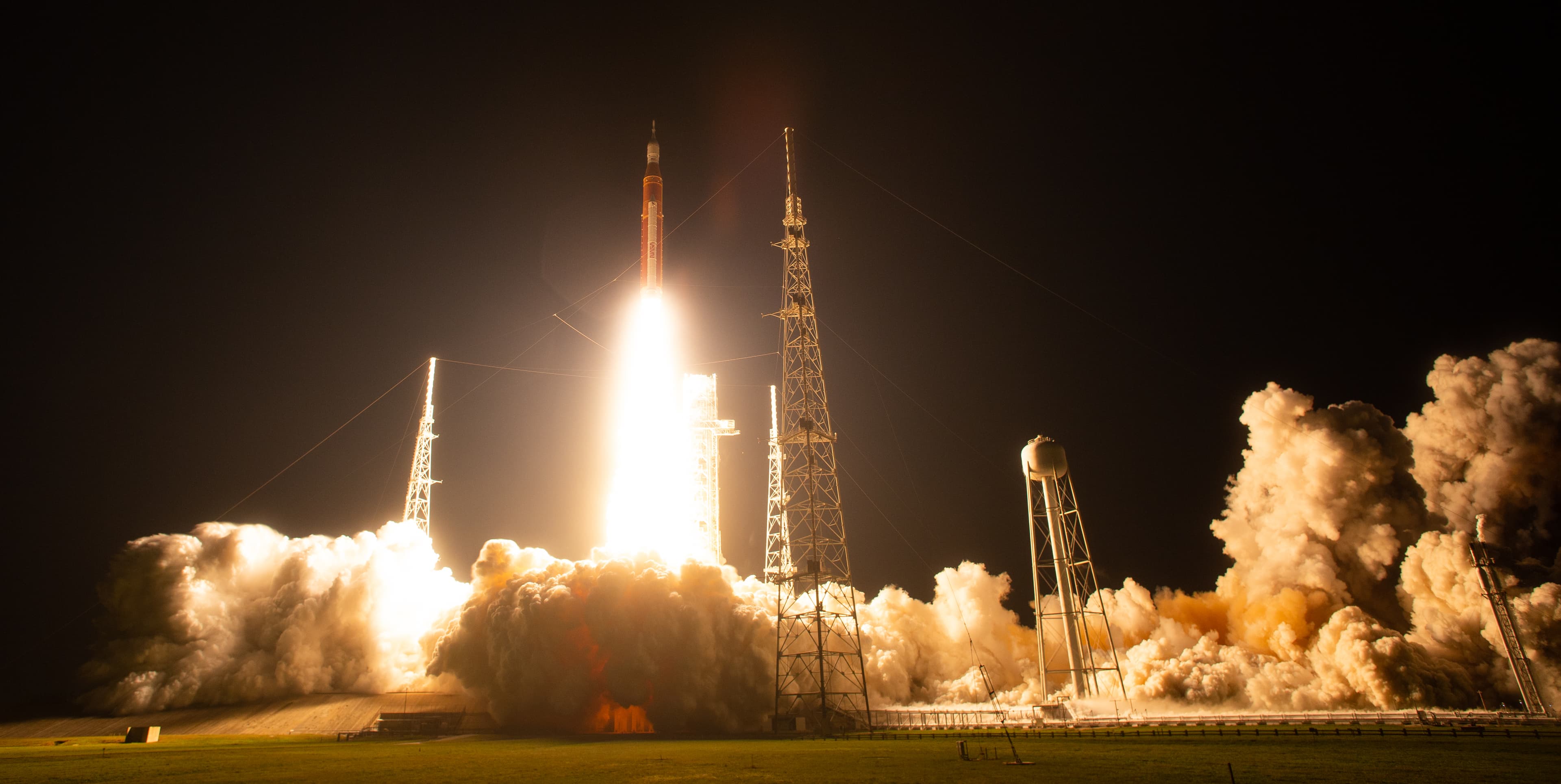 NASA's Artemis I Space Launch System rocket lifting Orion toward the Moon.